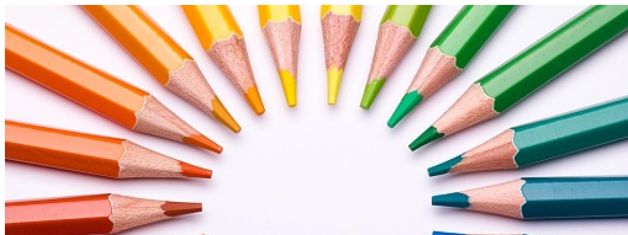 Colorful pencils pointing in a semicircle